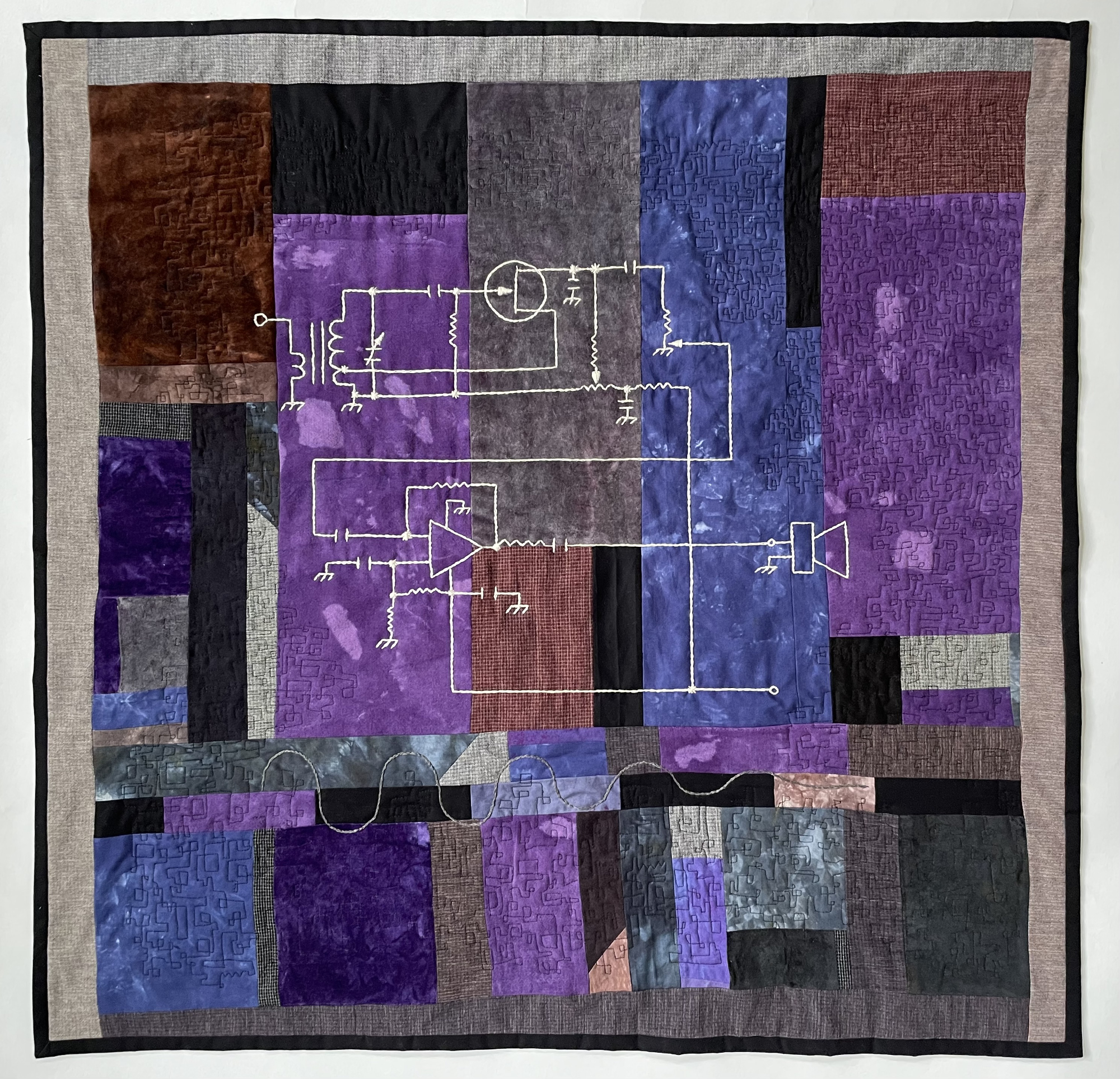 pieced abstract quilt with embroidered diagram of regenerative receiver