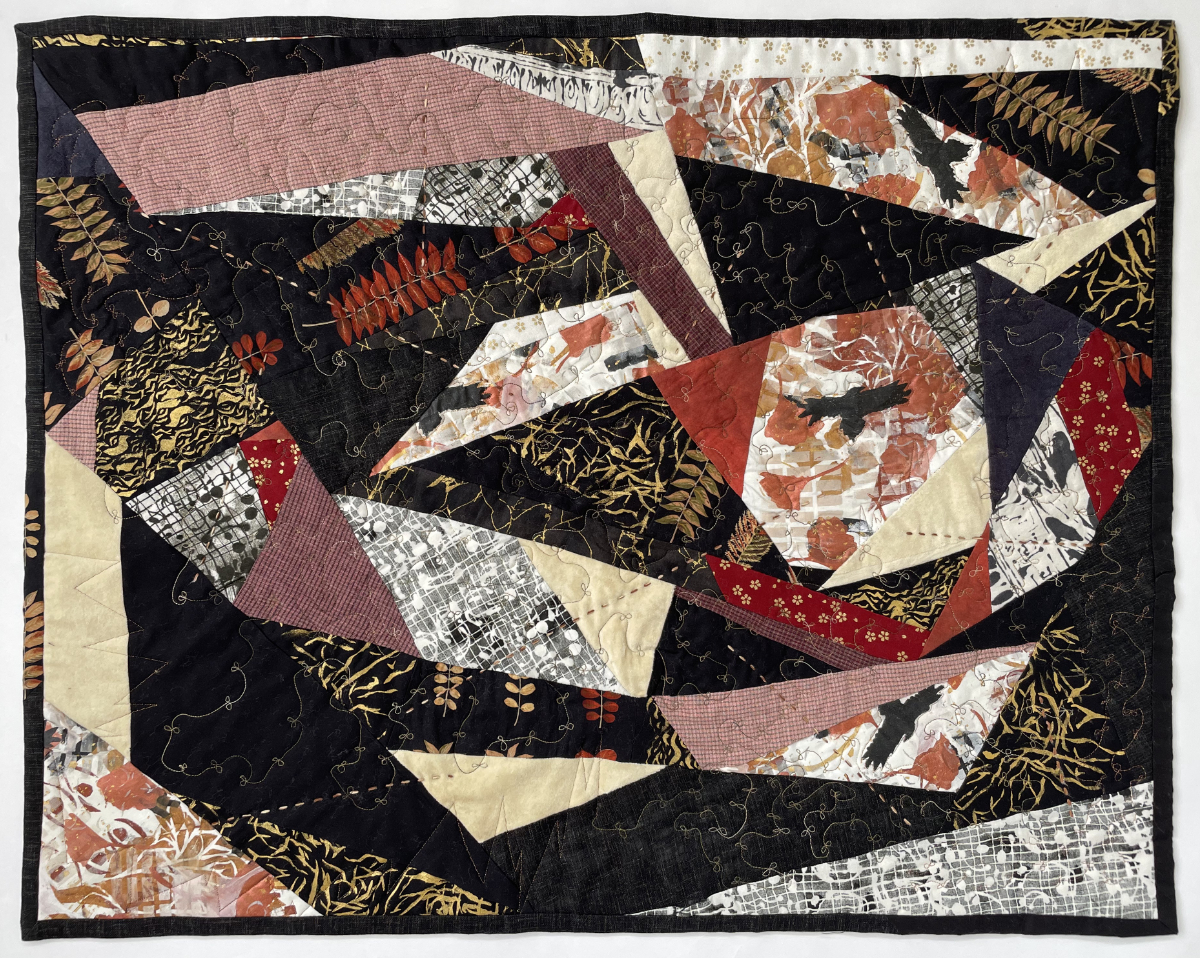 pieced quilt with abstract and fragmented shapes