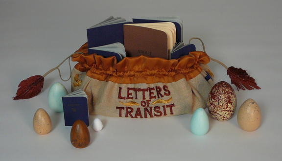 embroidered satchel with painted eggs and booklets