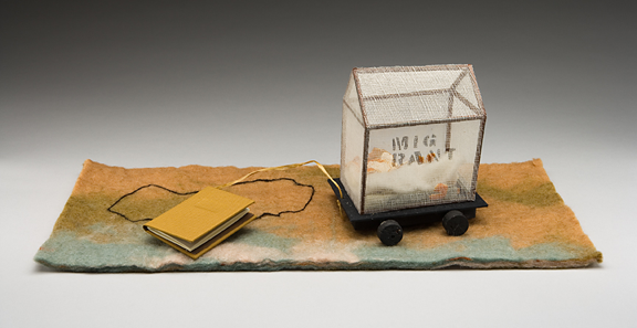felt with outline of California, house-shaped covered wagon attached to a string with small book