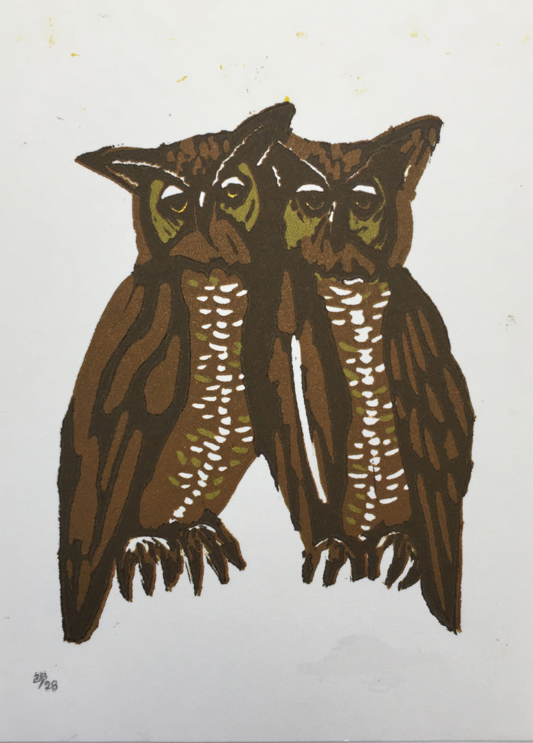 linocut of two owls with their heads touching