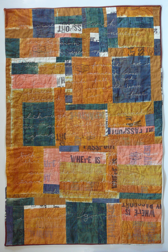 quilt with words and images taken from a passport with stitching of faces