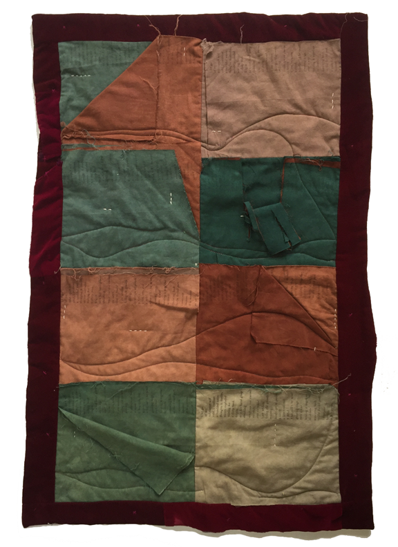 quilt with layers of fabric that are torn and stitched with a poem printed on them